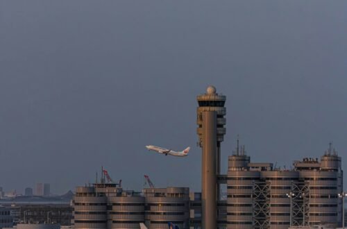 Air traffic controller monitoring flight paths, showing how much do air traffic controllers make a year with salary, shifts, and benefits.
