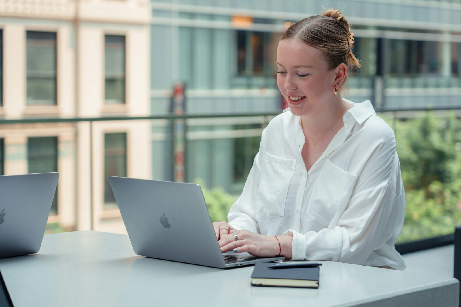 Writer working on a laptop preparing a write for us guest article for Life Lens Journey