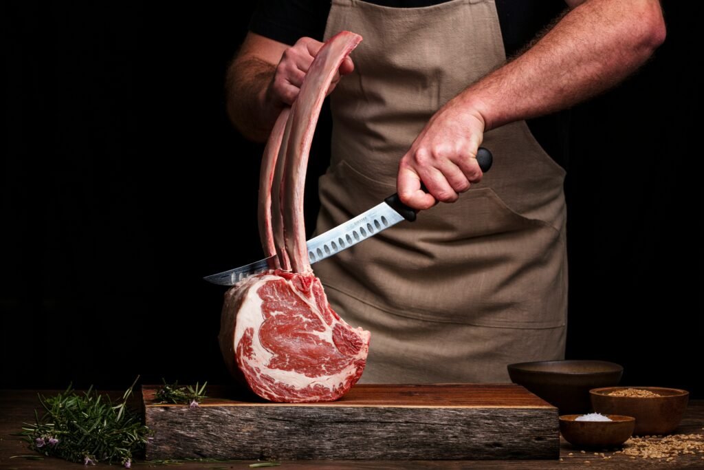 Thick slices of prime rib roast served with roasted vegetables and a savory crust.