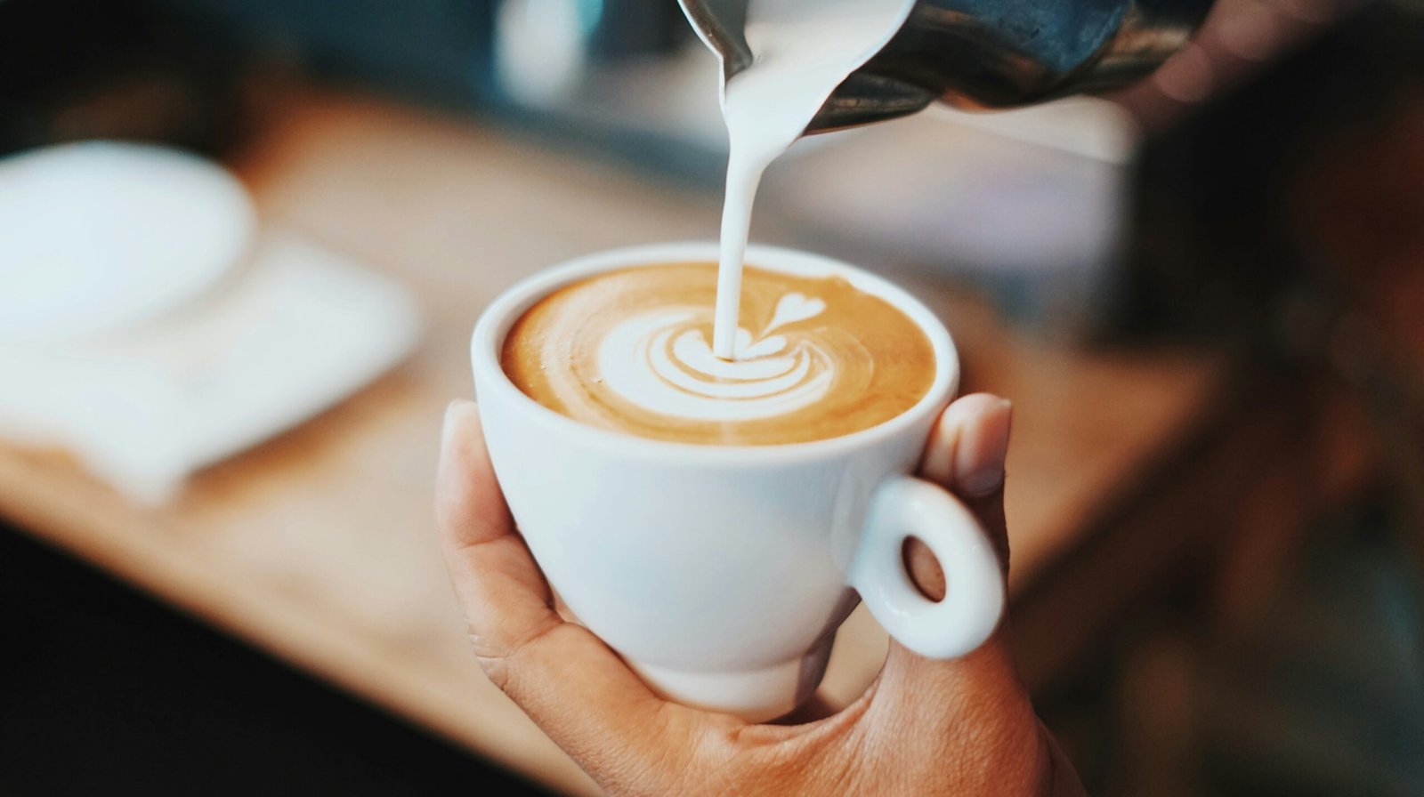 How to Make a Latte at Home featuring espresso brewing, milk frothing, creamy texture, latte art, and barista-style coffee.